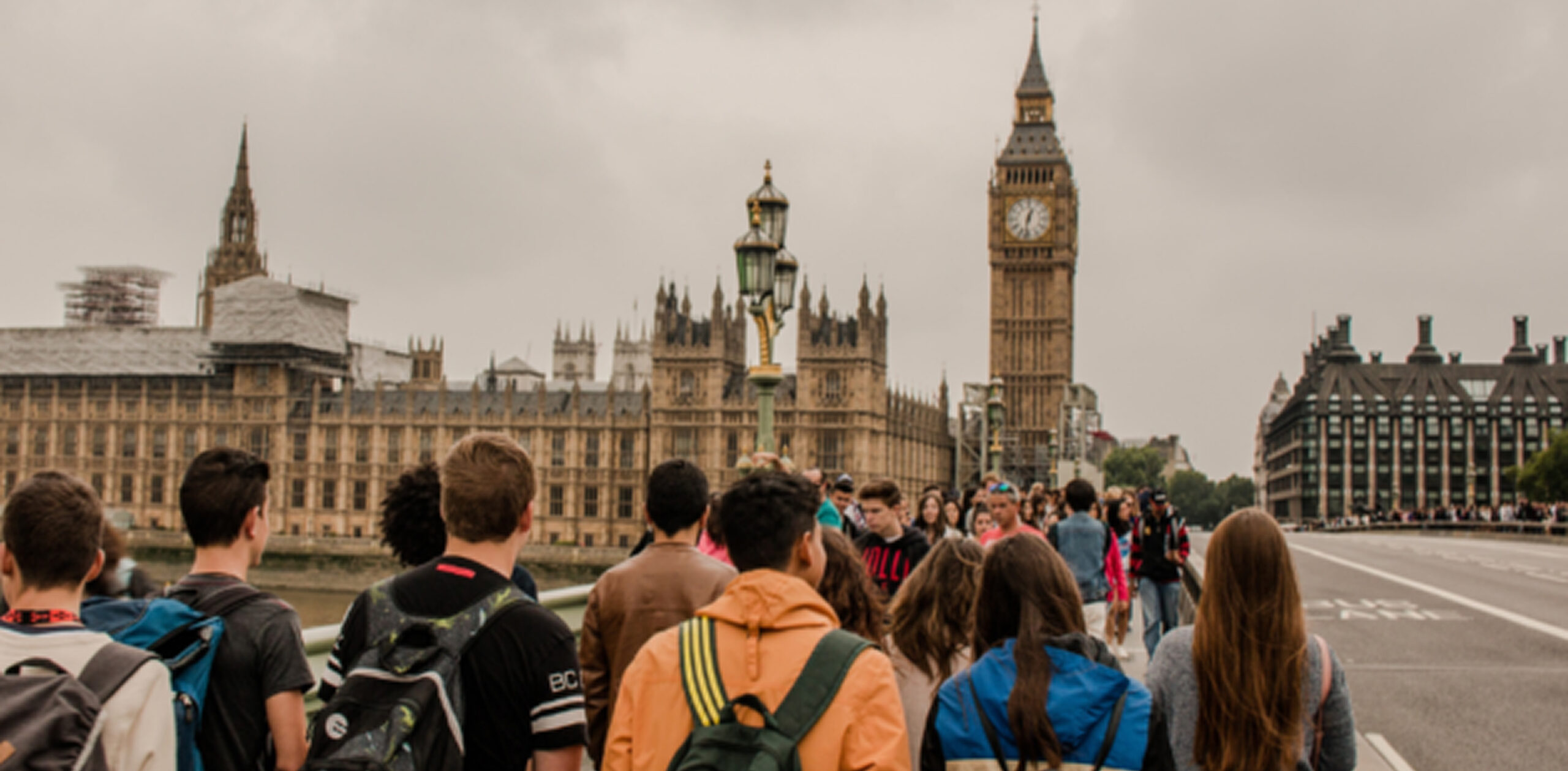 Students gathered in front of an international landmark.