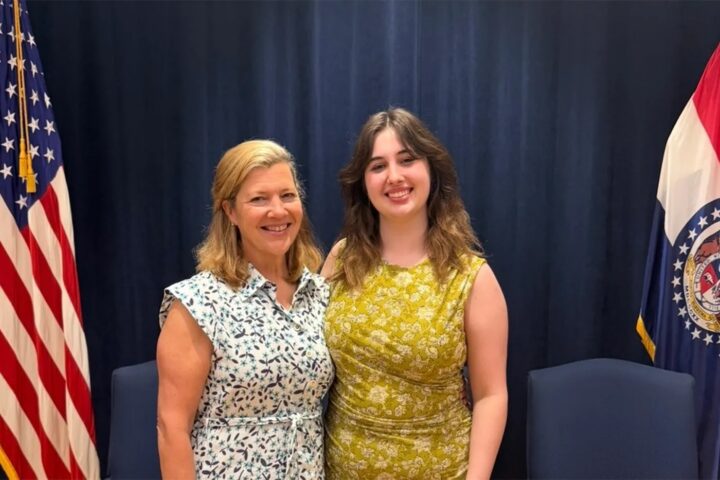 Two professionals posing for a picture together
